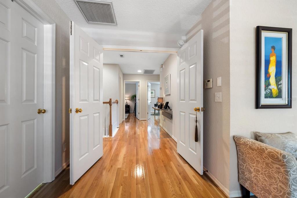 291 1st Avenue Southwest Largo, FL 33770 - Photo 42 of 83 a view of a hallway with wooden floor and furniture