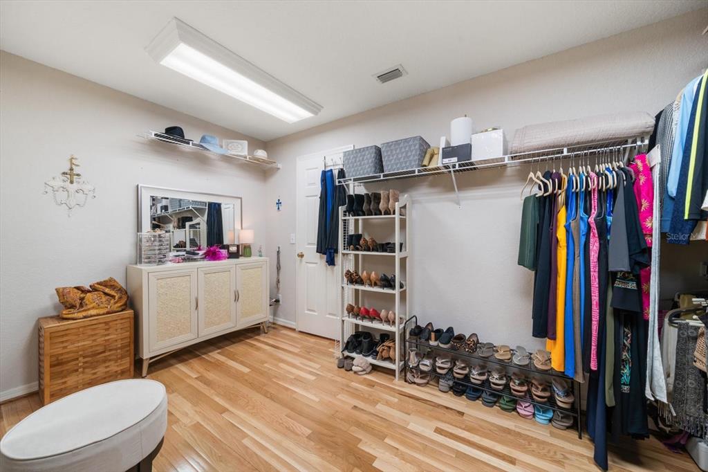 291 1st Avenue Southwest Largo, FL 33770 - Photo 48 of 83 a view of walk in closet with clothes and shoes