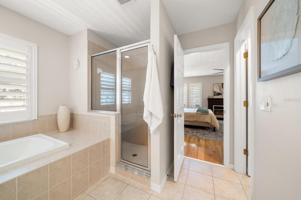 291 1st Avenue Southwest Largo, FL 33770 - Photo 53 of 83 a en suite bathroom with a tub shower and sink