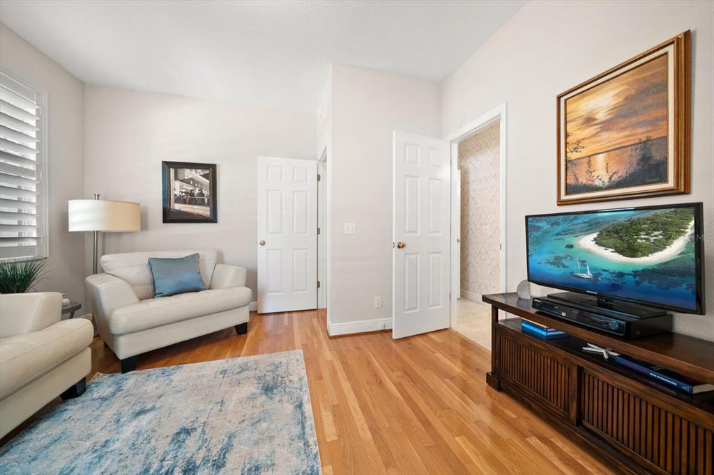 291 1st Avenue Southwest Largo, FL 33770 - Photo 57 of 83 a living room with furniture and a wooden floor