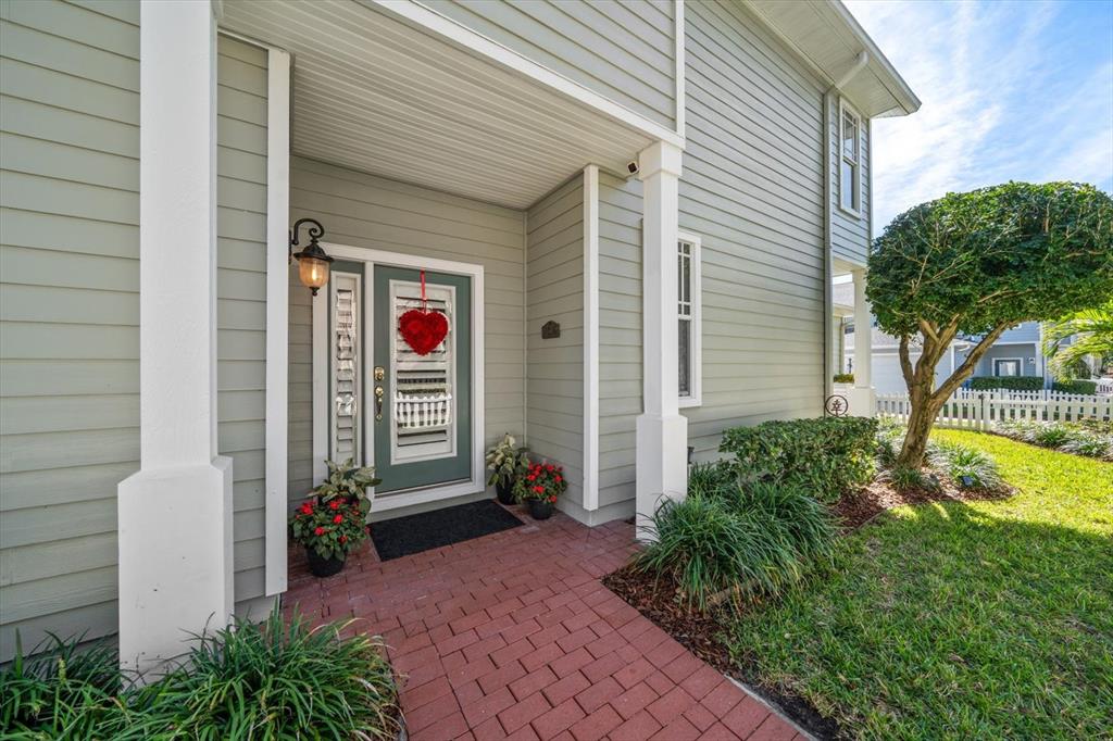 291 1st Avenue Southwest Largo, FL 33770 - Photo 7 of 83 a view of a house with potted plants and a small yard