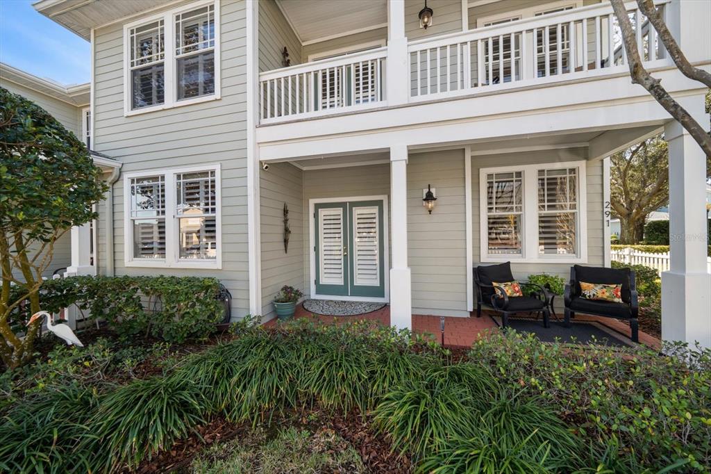 291 1st Avenue Southwest Largo, FL 33770 - Photo 72 of 83 front view of a brick house with a large windows and a potted plant