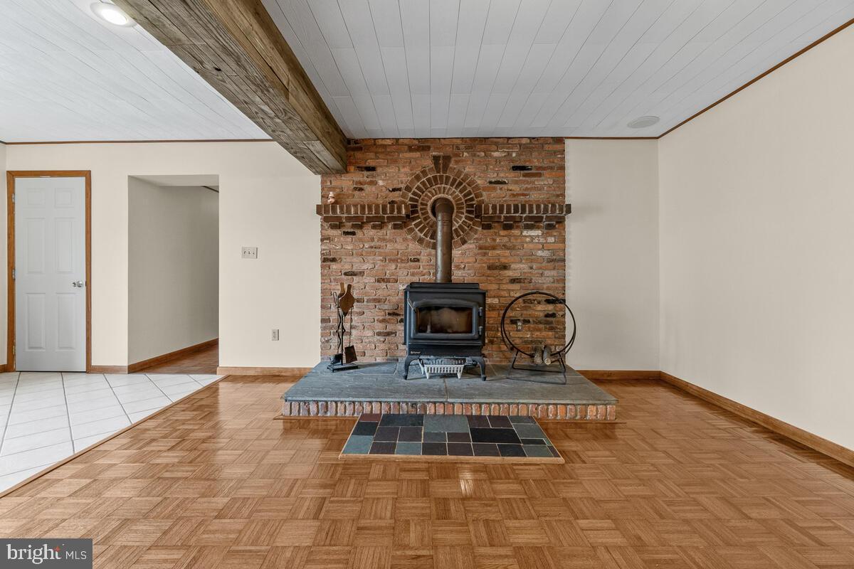 14134 Harrisville Road Mount Airy, MD 21771 - Photo 22 of 41 Enjoy winter evenings around the wood stove.