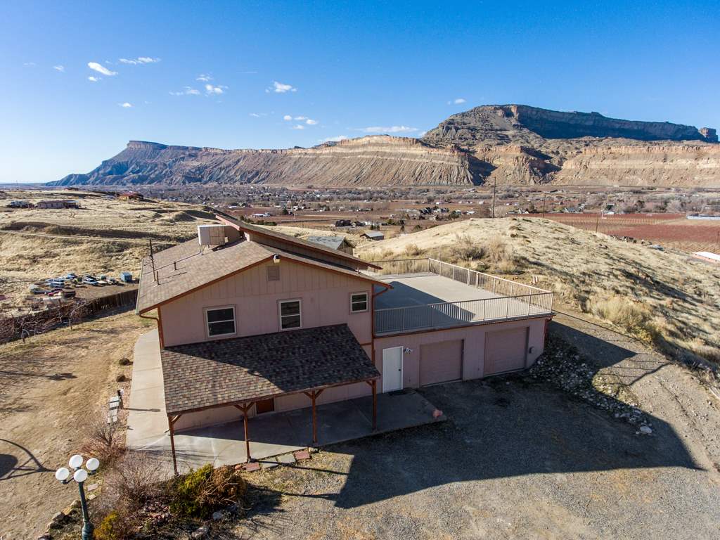 653 39 Road Palisade, CO 81526 - Photo 1 of 35 a view of a terrace with a mountain