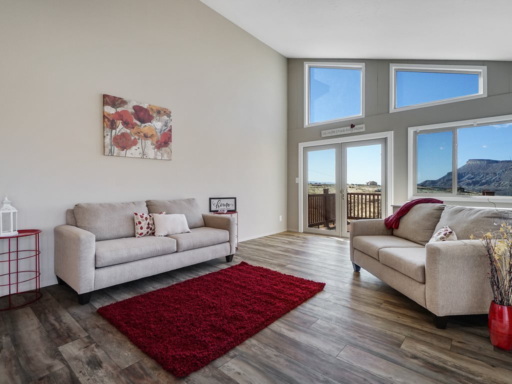653 39 Road Palisade, CO 81526 - Photo 11 of 35 a living room with furniture or couch and a wooden floor