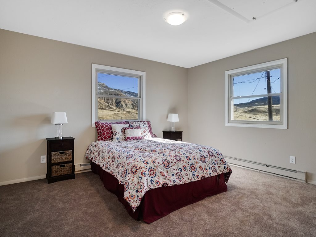 653 39 Road Palisade, CO 81526 - Photo 20 of 35 a bedroom with a bed and a desk