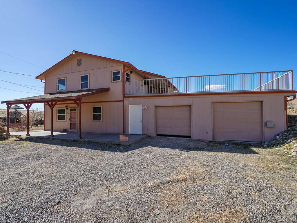 653 39 Road Palisade, CO 81526 - Photo 29 of 35 a view of a house with a backyard