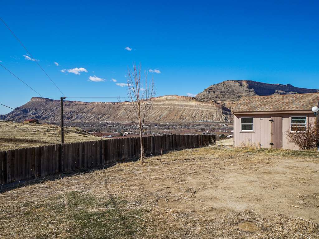 653 39 Road Palisade, CO 81526 - Photo 32 of 35 a view of a house with a snow in the yard