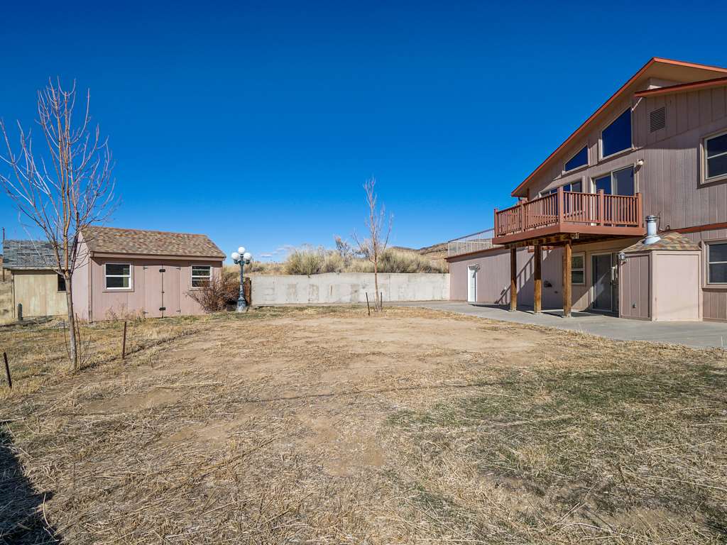 653 39 Road Palisade, CO 81526 - Photo 33 of 35 a view of a house with a yard