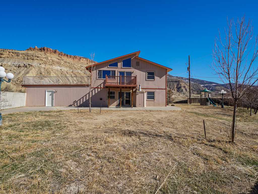 653 39 Road Palisade, CO 81526 - Photo 34 of 35 a view of a house with a yard