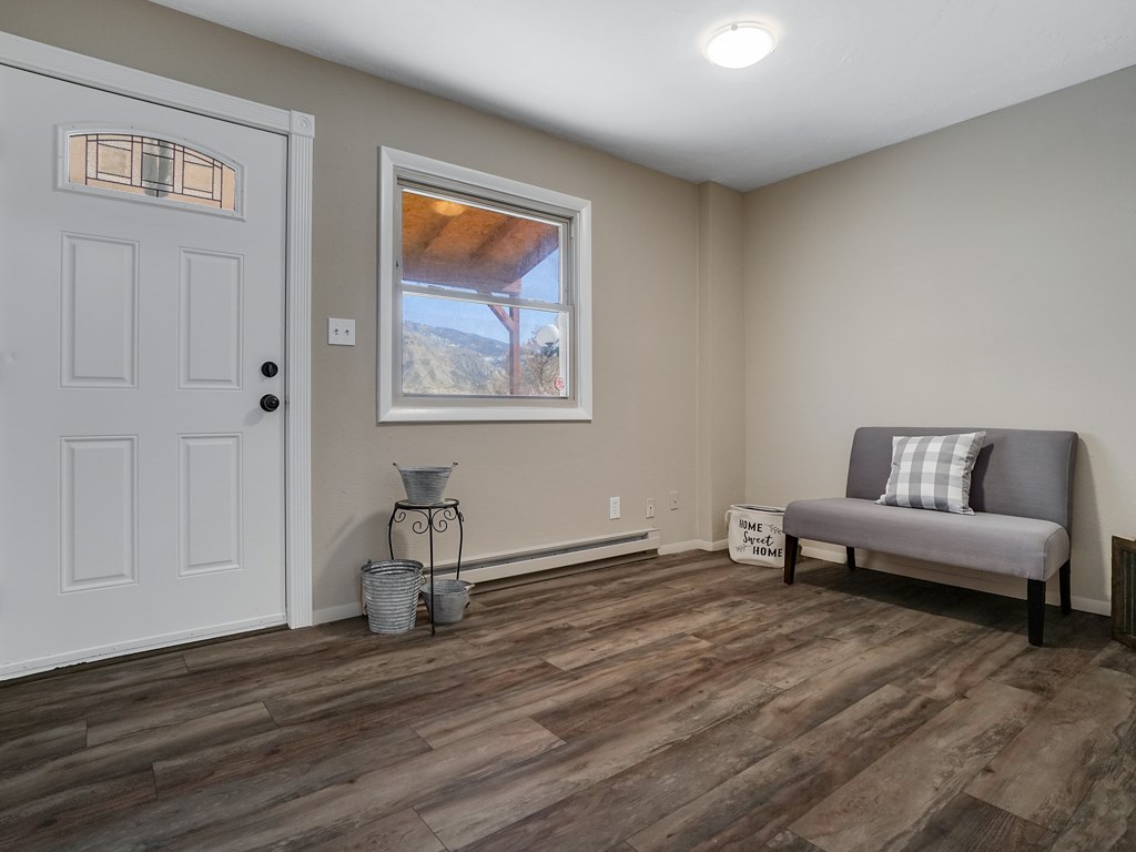 653 39 Road Palisade, CO 81526 - Photo 4 of 35 a living room with furniture and a wooden floor