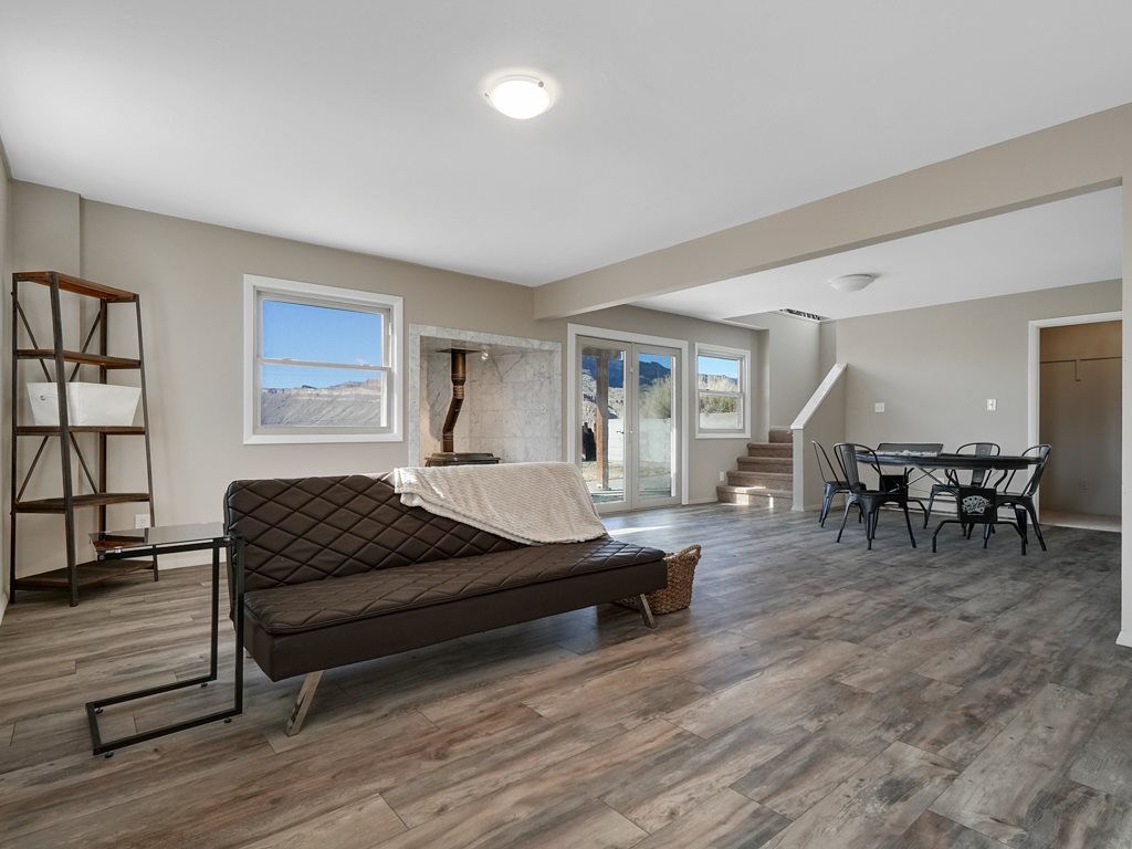 653 39 Road Palisade, CO 81526 - Photo 5 of 35 a living room with furniture and wooden floor