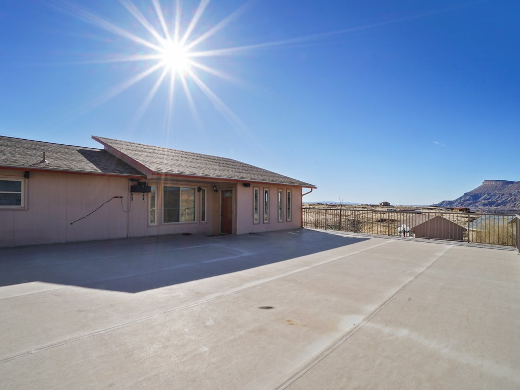 653 39 Road Palisade, CO 81526 - Photo 9 of 35 a view of a house with a roof deck