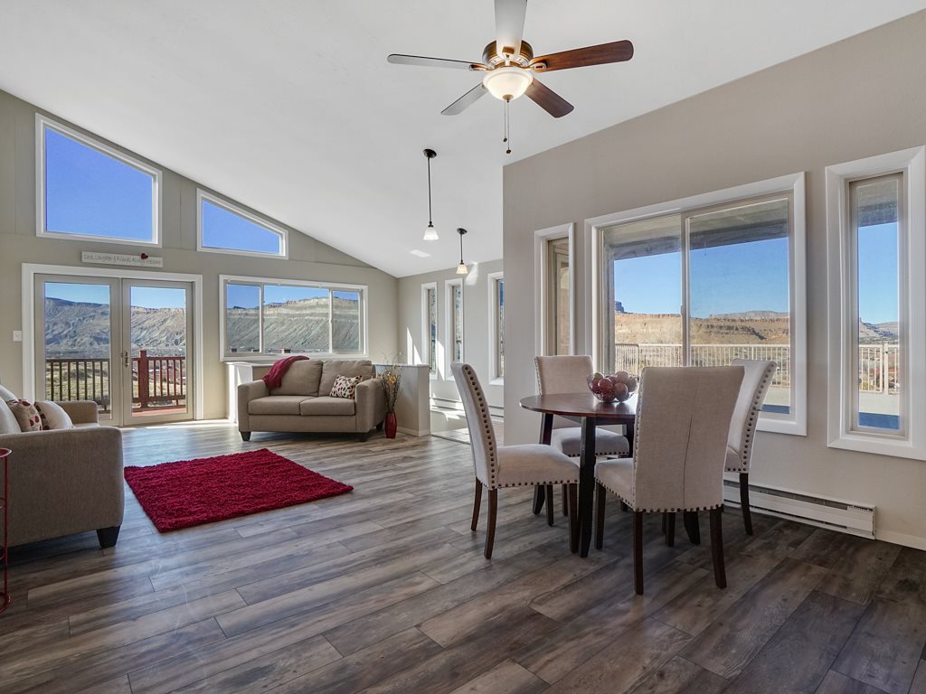 653 39 Road Palisade, CO 81526 - Photo 10 of 35 a living room with furniture wooden floor and a window