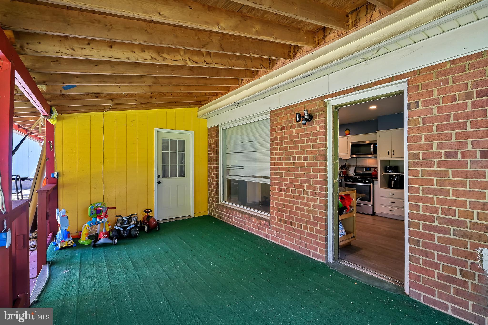 12900 Goodhill Road Silver Spring, MD 20906 - Photo 22 of 26 Backyard porch and bonus room