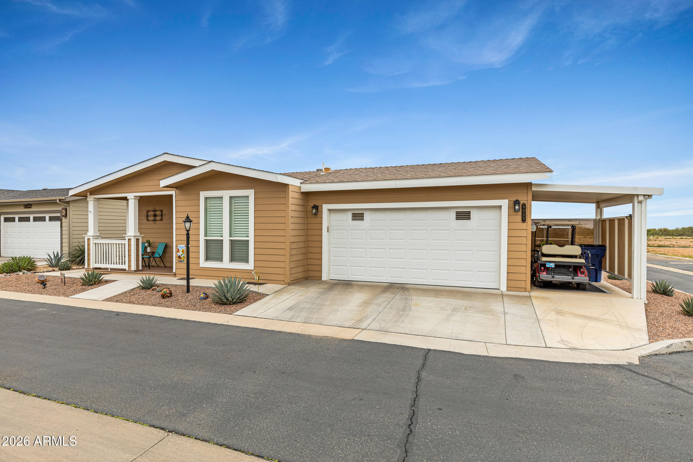 a front view of a house with a garage