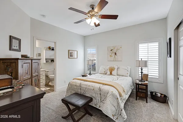 a bedroom with a bed and a desk