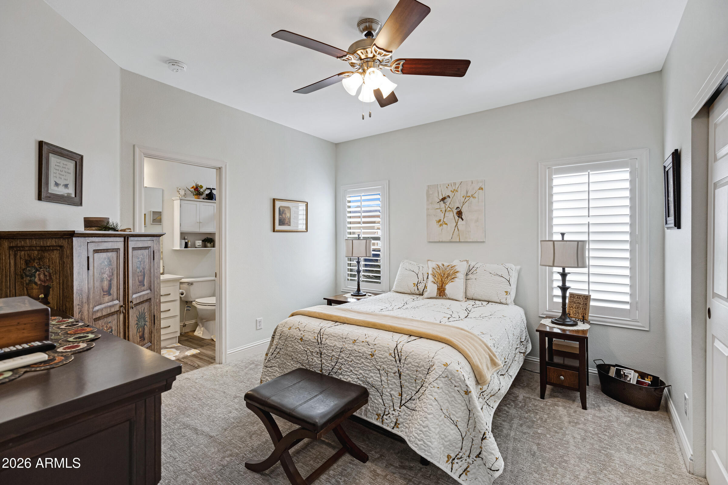 3301 South Goldfield Road, Unit 6055 Apache Junction, AZ 85119 - Photo 25 of 49 a bedroom with a bed and a desk
