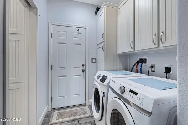 a utility room with dryer and washer