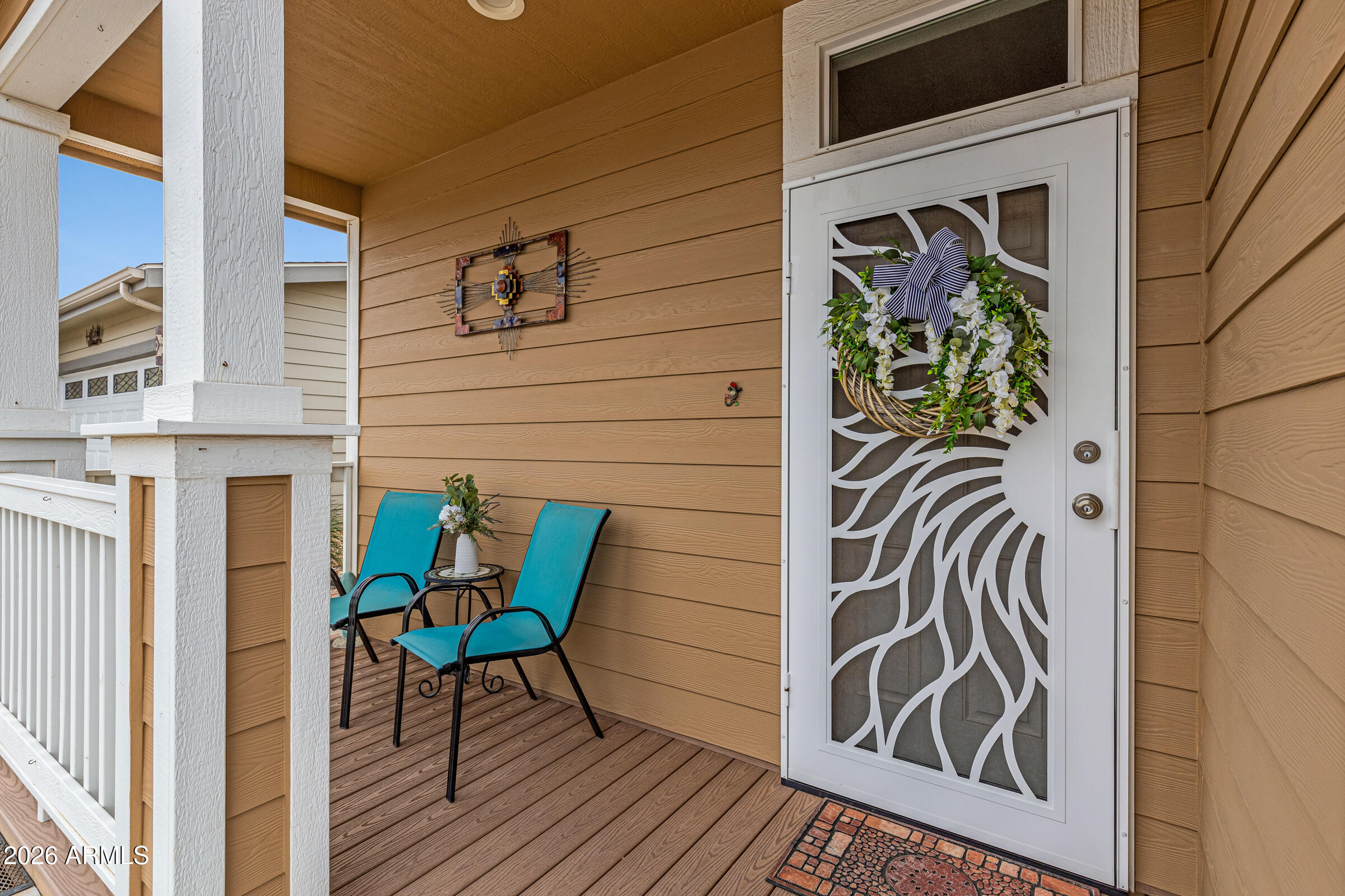 3301 South Goldfield Road, Unit 6055 Apache Junction, AZ 85119 - Photo 3 of 49 a view of a door and chair in the balcony
