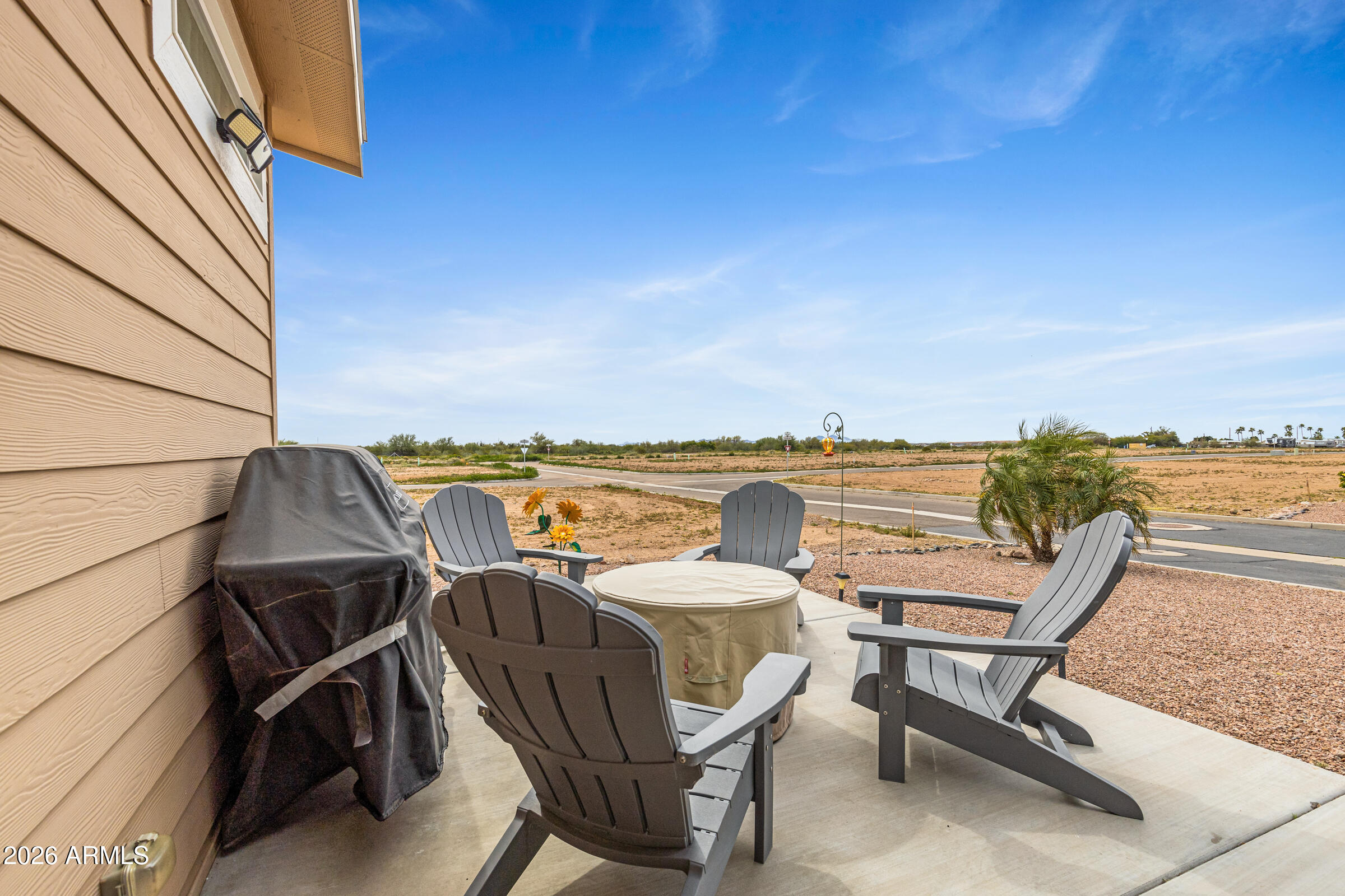 3301 South Goldfield Road, Unit 6055 Apache Junction, AZ 85119 - Photo 32 of 49 a view of a terrace with chairs