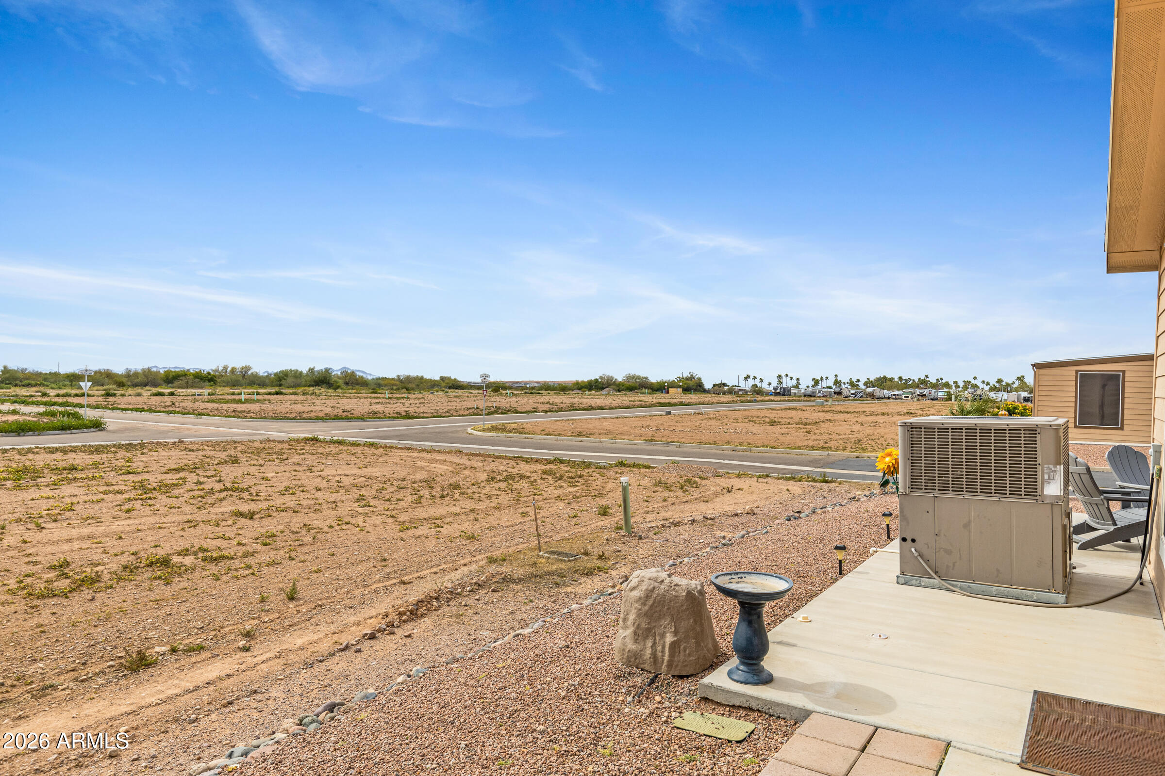3301 South Goldfield Road, Unit 6055 Apache Junction, AZ 85119 - Photo 33 of 49 a view of a lake with outdoor space