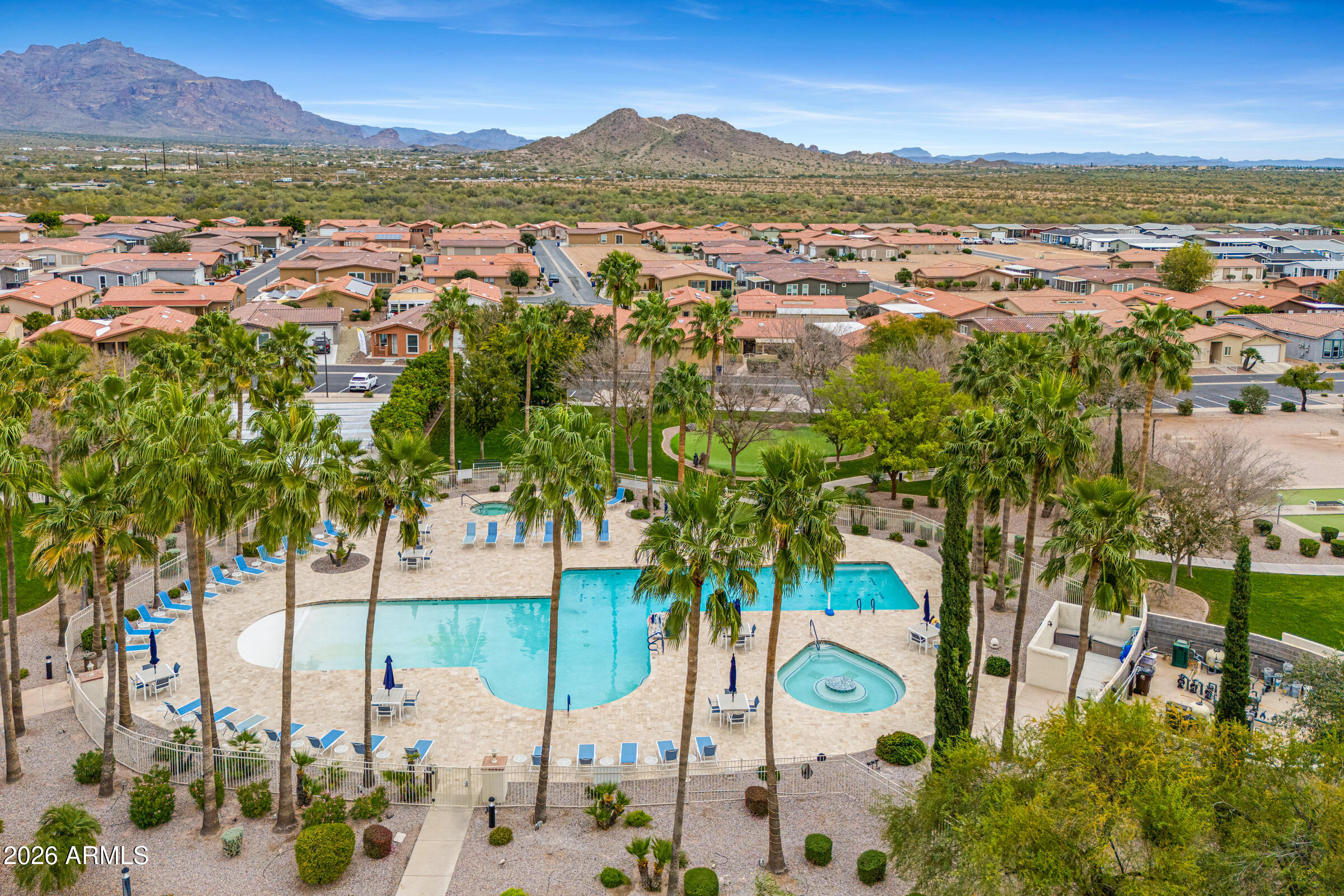 3301 South Goldfield Road, Unit 6055 Apache Junction, AZ 85119 - Photo 34 of 49 an aerial view of residential houses with outdoor space and seating