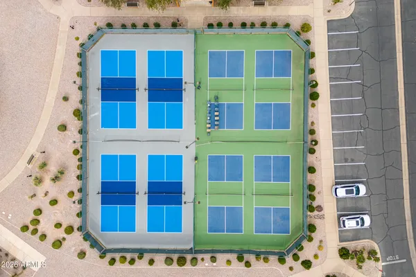 a view of a swimming pool with a yard