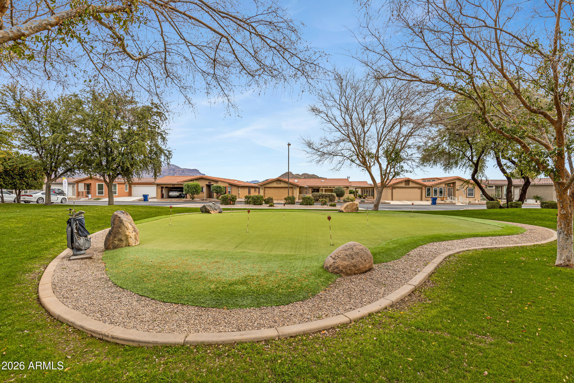 3301 South Goldfield Road, Unit 6055 Apache Junction, AZ 85119 - Photo 42 of 49 a view of a swimming pool with a yard