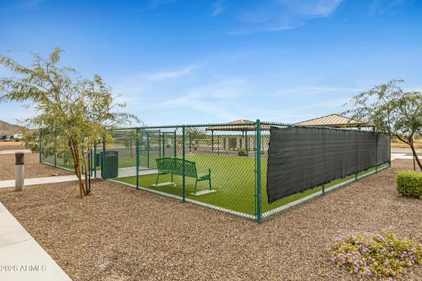 a view of a swimming pool and an outdoor seating