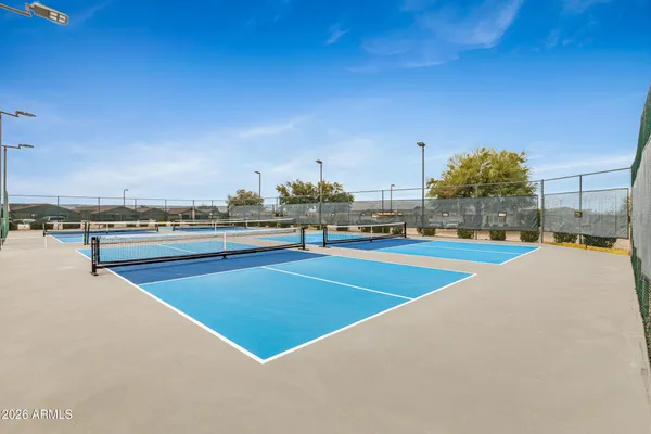 a view of building with cars parked