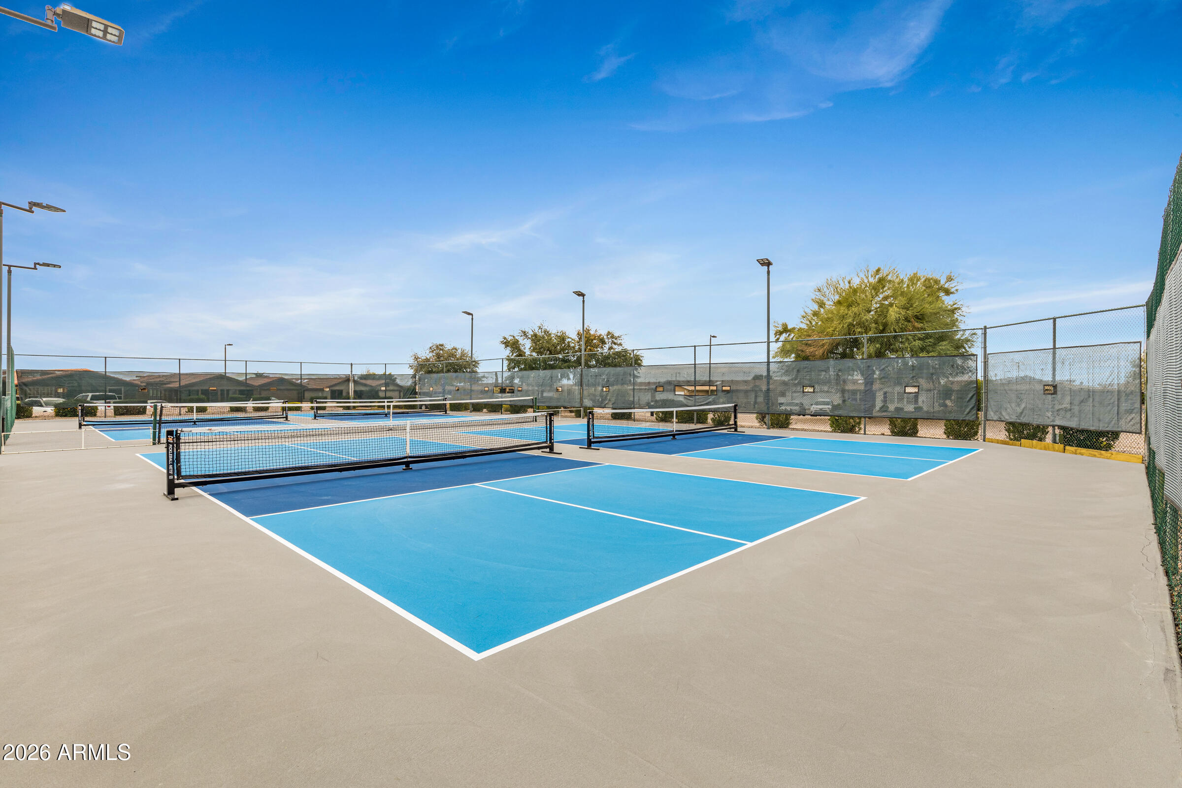3301 South Goldfield Road, Unit 6055 Apache Junction, AZ 85119 - Photo 44 of 49 a view of a swimming pool and an outdoor seating