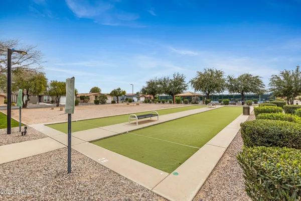 a view of a swimming pool with an outdoor space and seating area