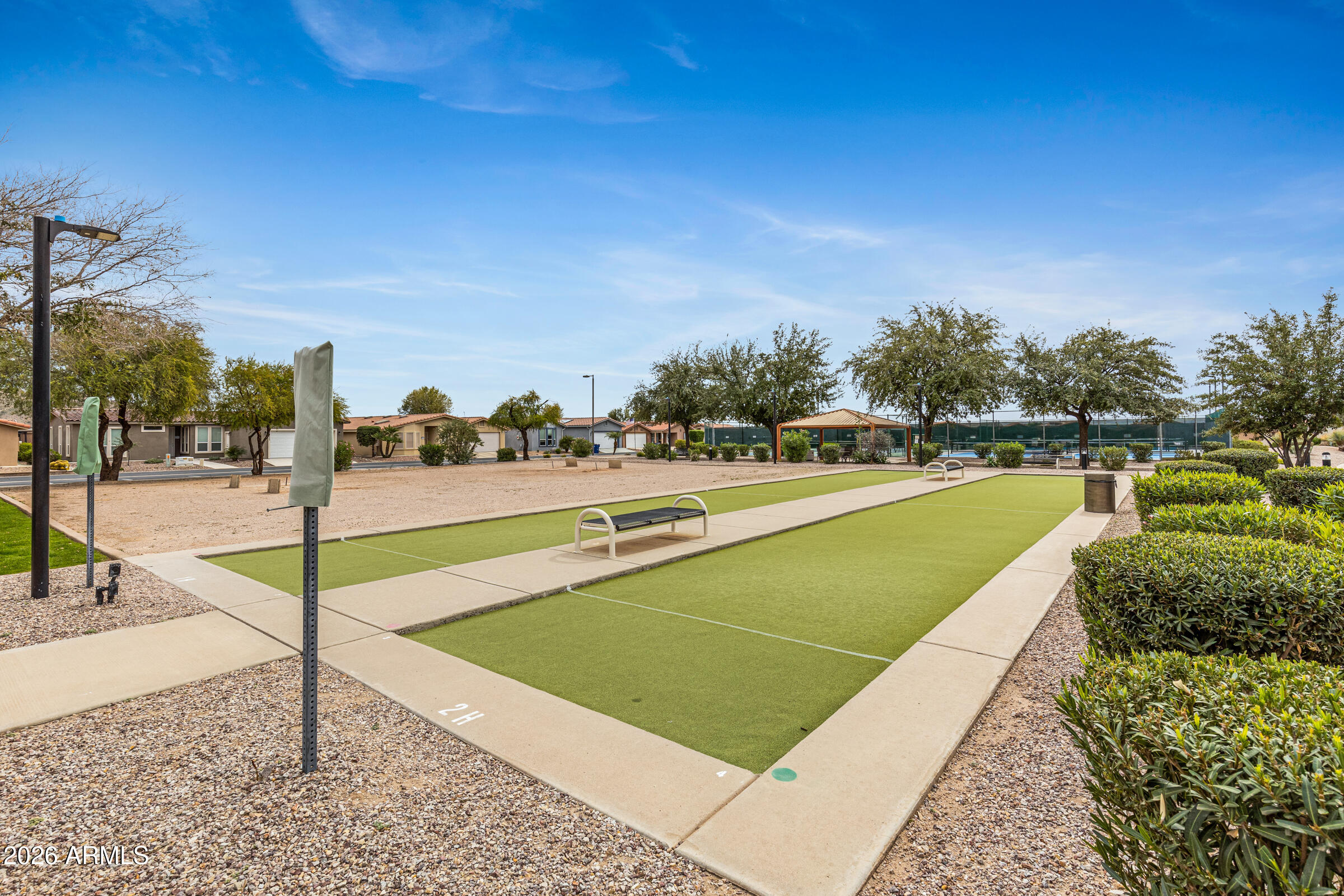 3301 South Goldfield Road, Unit 6055 Apache Junction, AZ 85119 - Photo 46 of 49 a view of a swimming pool and a yard