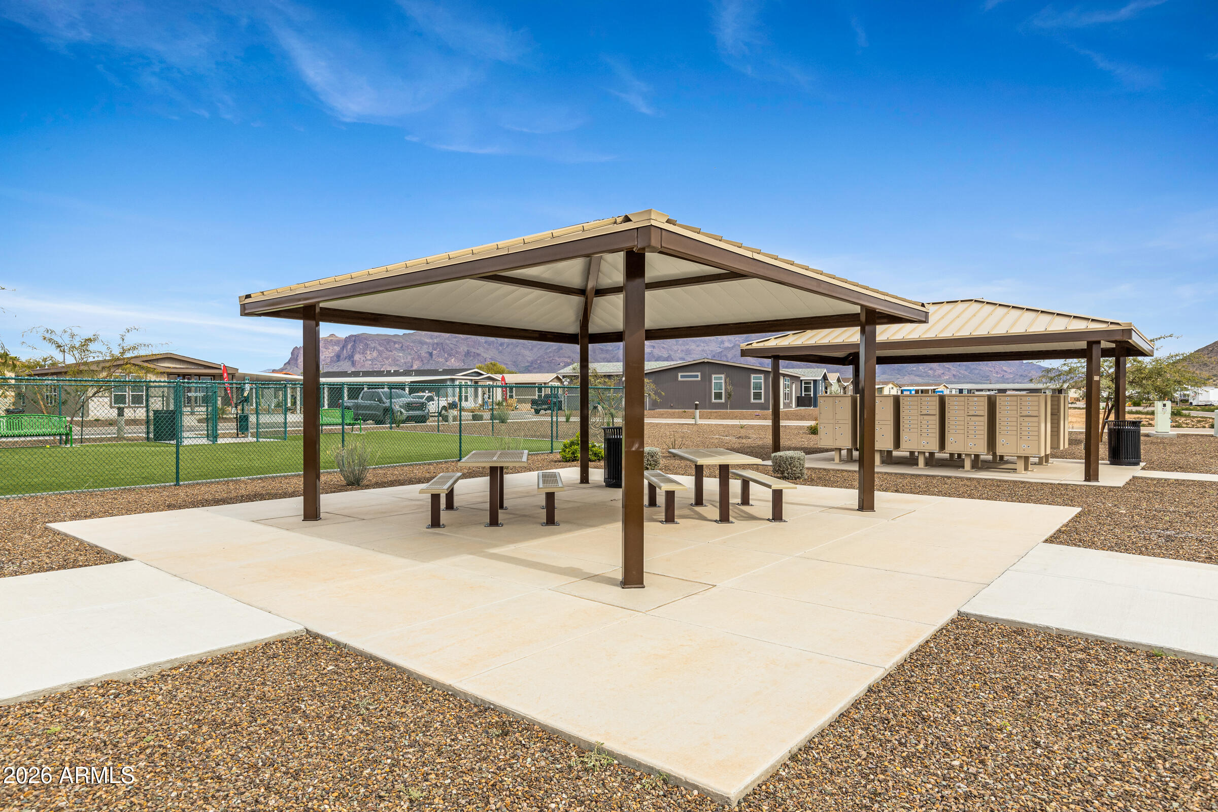 3301 South Goldfield Road, Unit 6055 Apache Junction, AZ 85119 - Photo 49 of 49 a view of a swimming pool with a patio