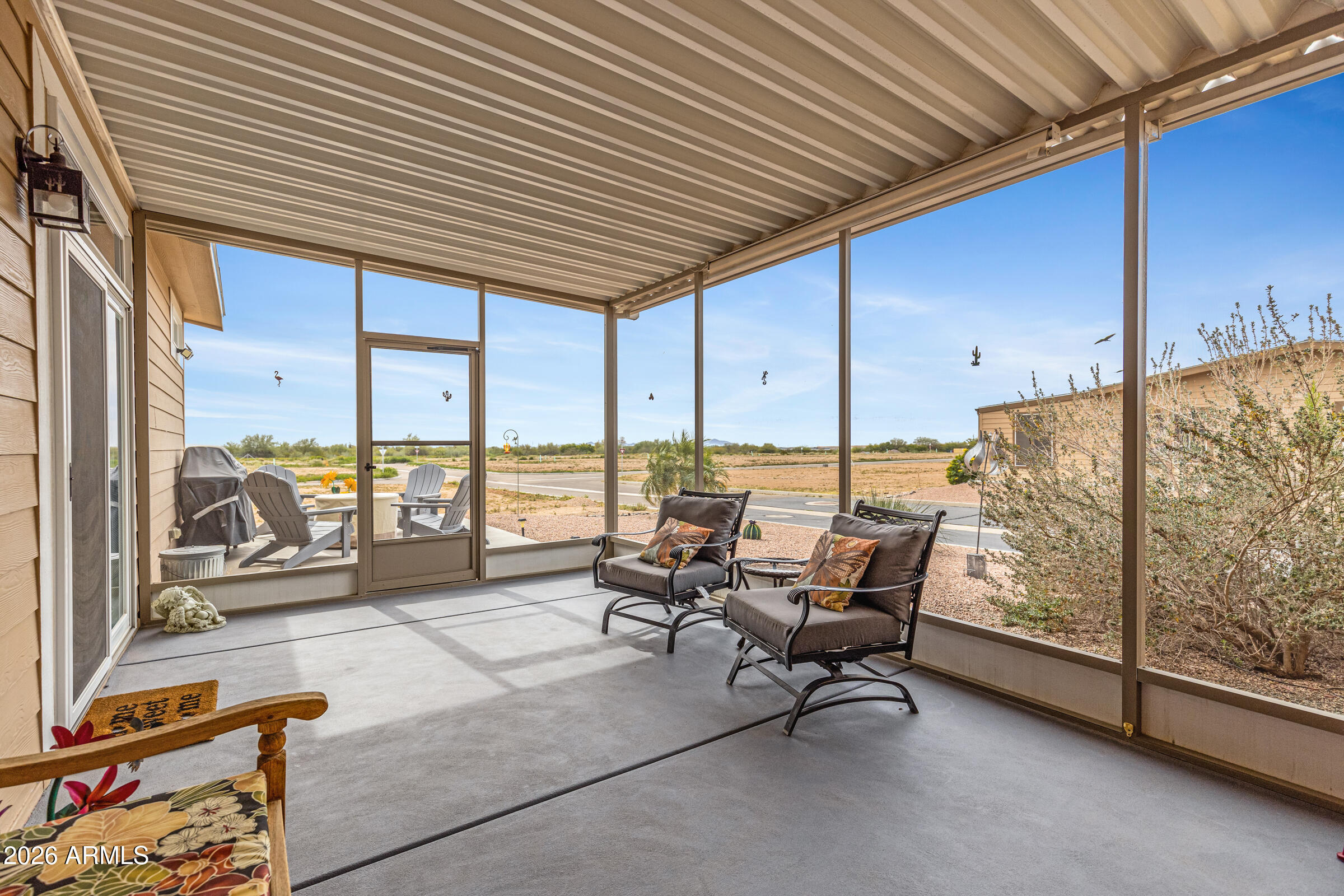 3301 South Goldfield Road, Unit 6055 Apache Junction, AZ 85119 - Photo 6 of 49 a building outdoor space with patio furniture