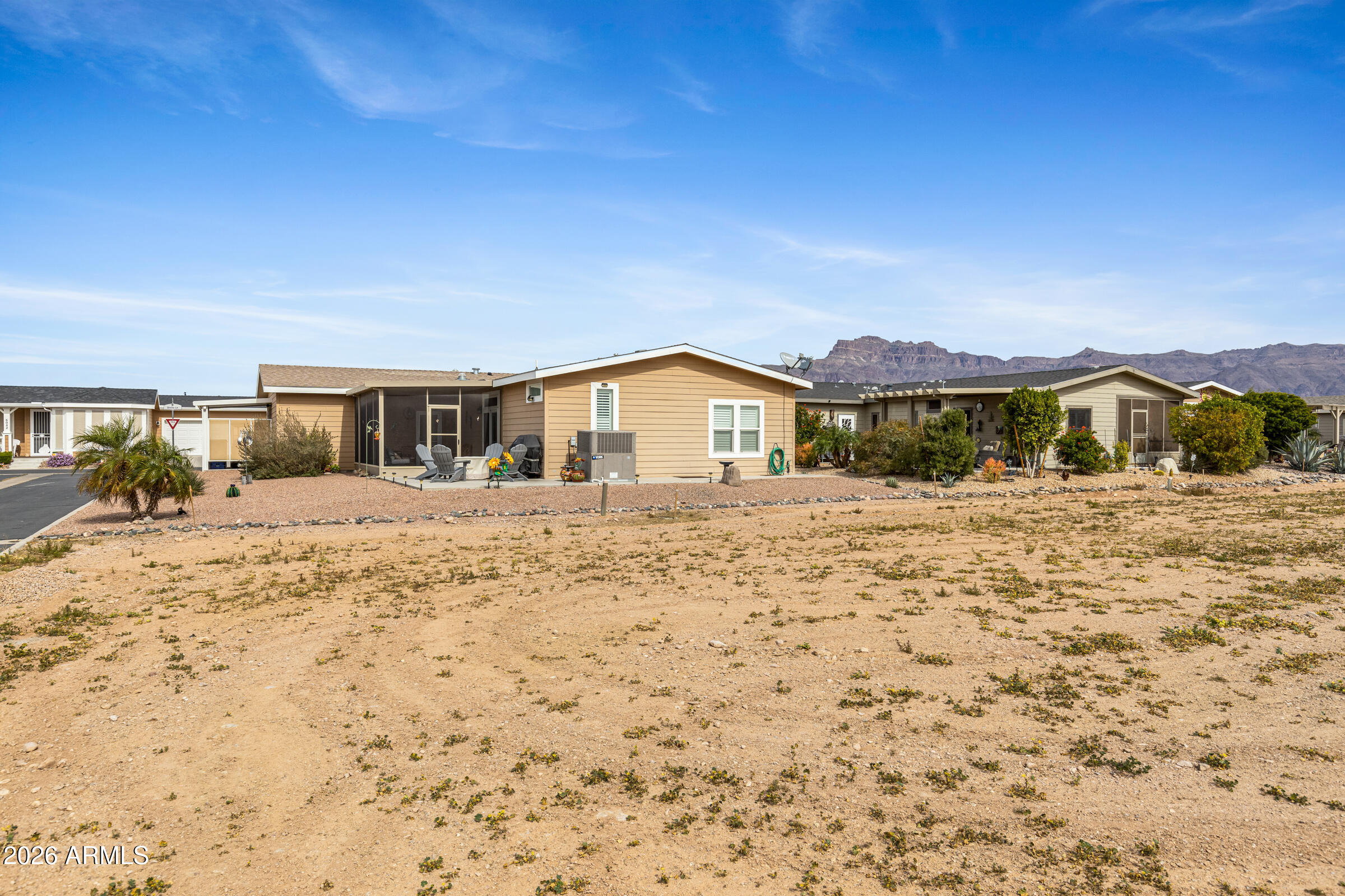 3301 South Goldfield Road, Unit 6055 Apache Junction, AZ 85119 - Photo 7 of 49 a view of house with yard and ocean view