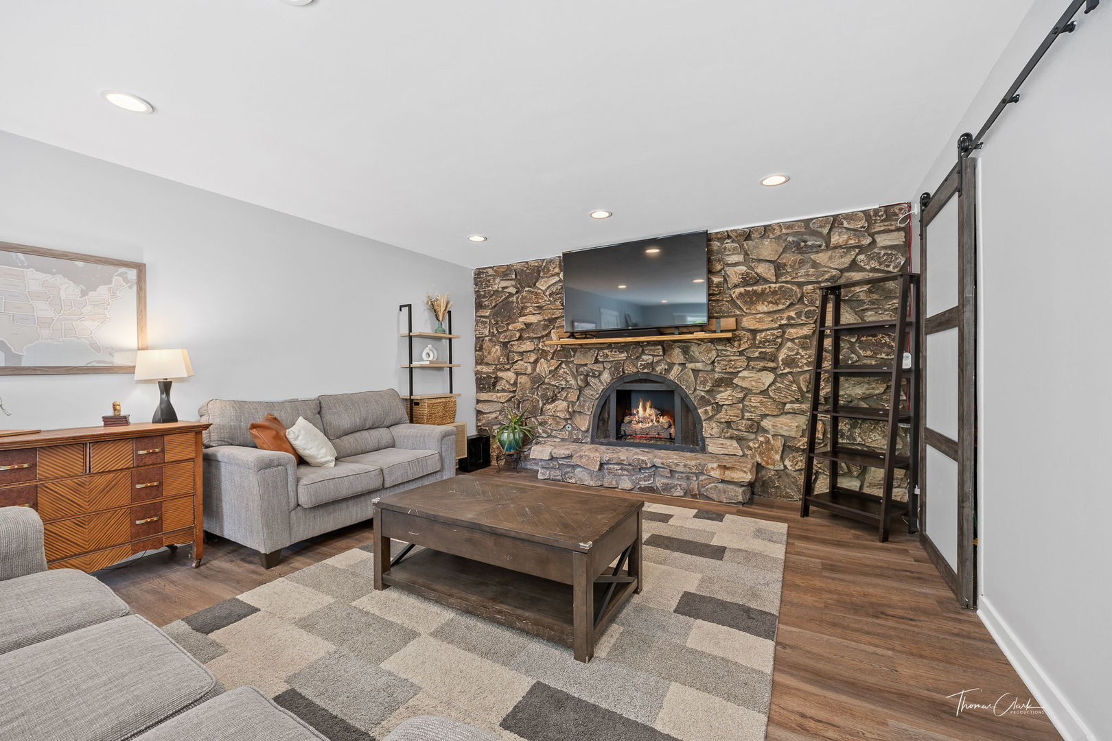 418 Kipling Court Wheaton, IL 60187 - Photo 16 of 47 a living room with furniture a flat screen tv and a fireplace