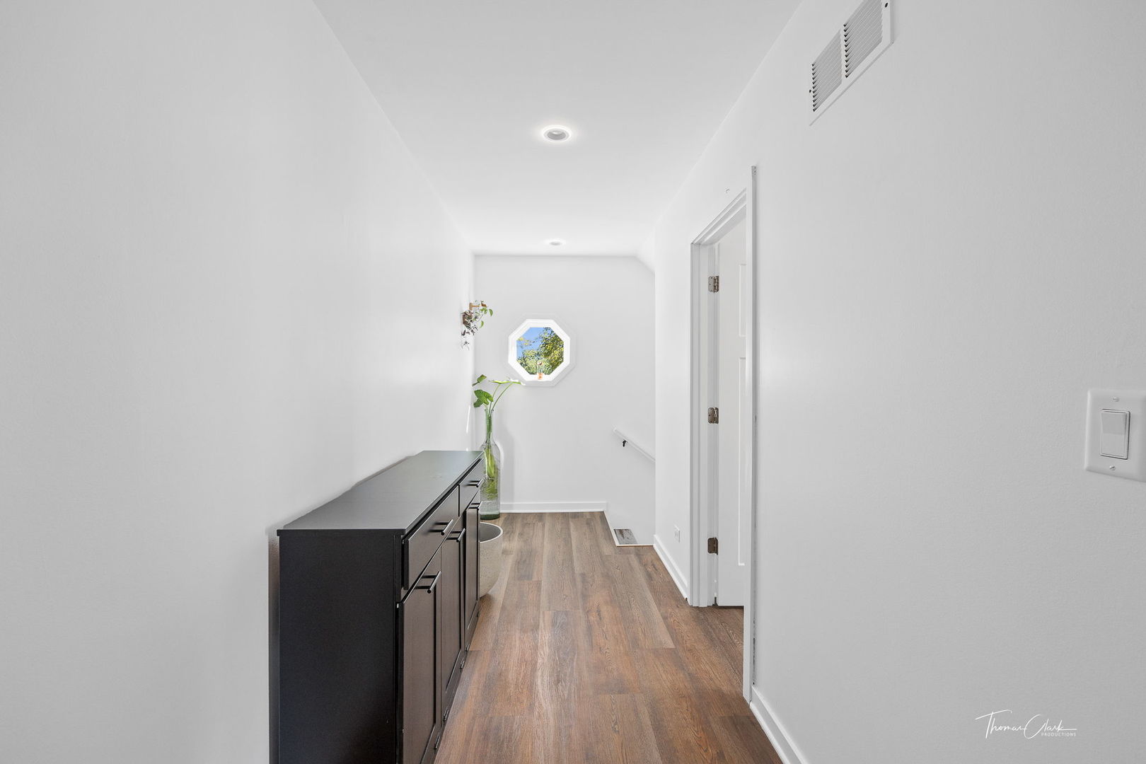 418 Kipling Court Wheaton, IL 60187 - Photo 26 of 47 a view of a hallway with wooden floor and staircase
