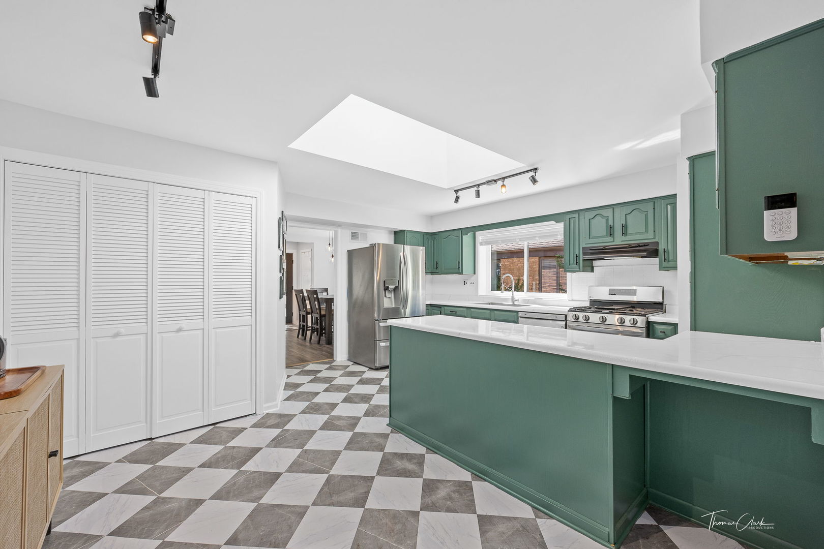 418 Kipling Court Wheaton, IL 60187 - Photo 10 of 47 a kitchen with stainless steel appliances granite countertop a sink and a refrigerator