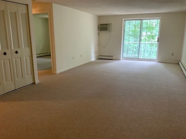 121 North Street, Unit 2 Medfield, MA 02052 - Photo 2 of 4 an empty room with windows