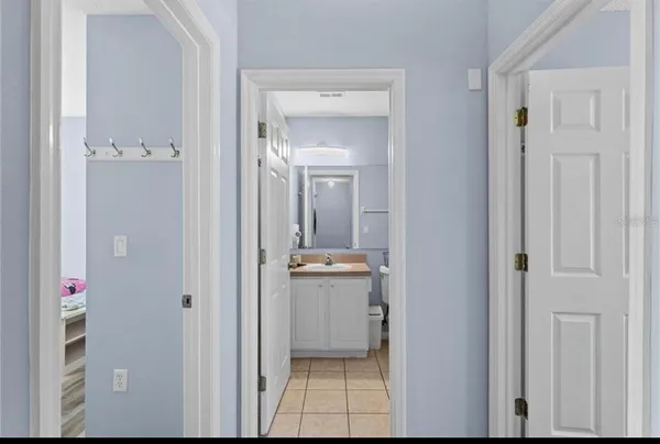 a view of a hallway with dining area