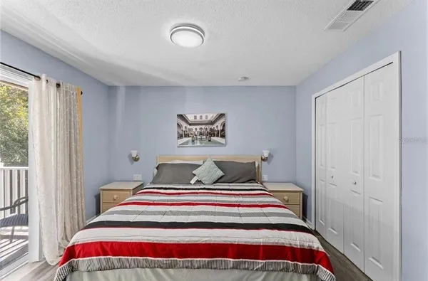 a bedroom with bed and a window