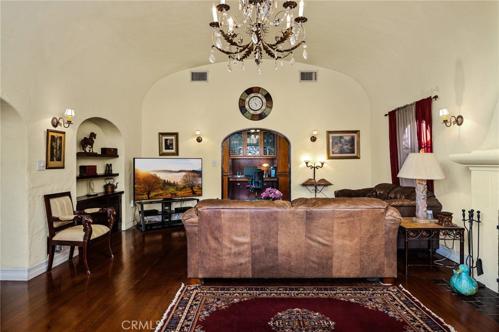 4202 University Riverside, CA 92501 - Photo 20 of 53 a living room with fireplace furniture and wooden floor