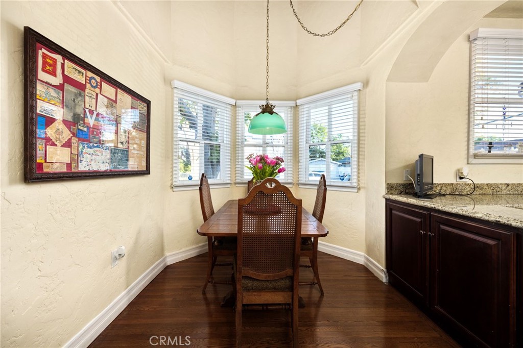 4202 University Riverside, CA 92501 - Photo 27 of 53 a view of a dining room with furniture a chandelier and wooden floor