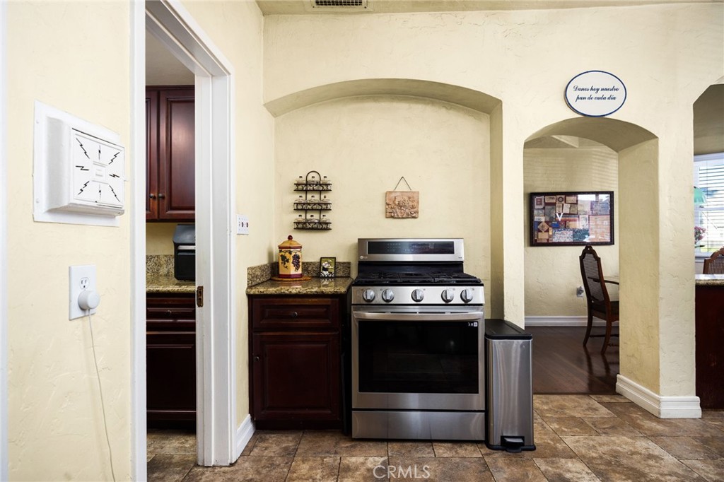 4202 University Riverside, CA 92501 - Photo 28 of 53 a kitchen with stainless steel appliances granite countertop a stove and a refrigerator