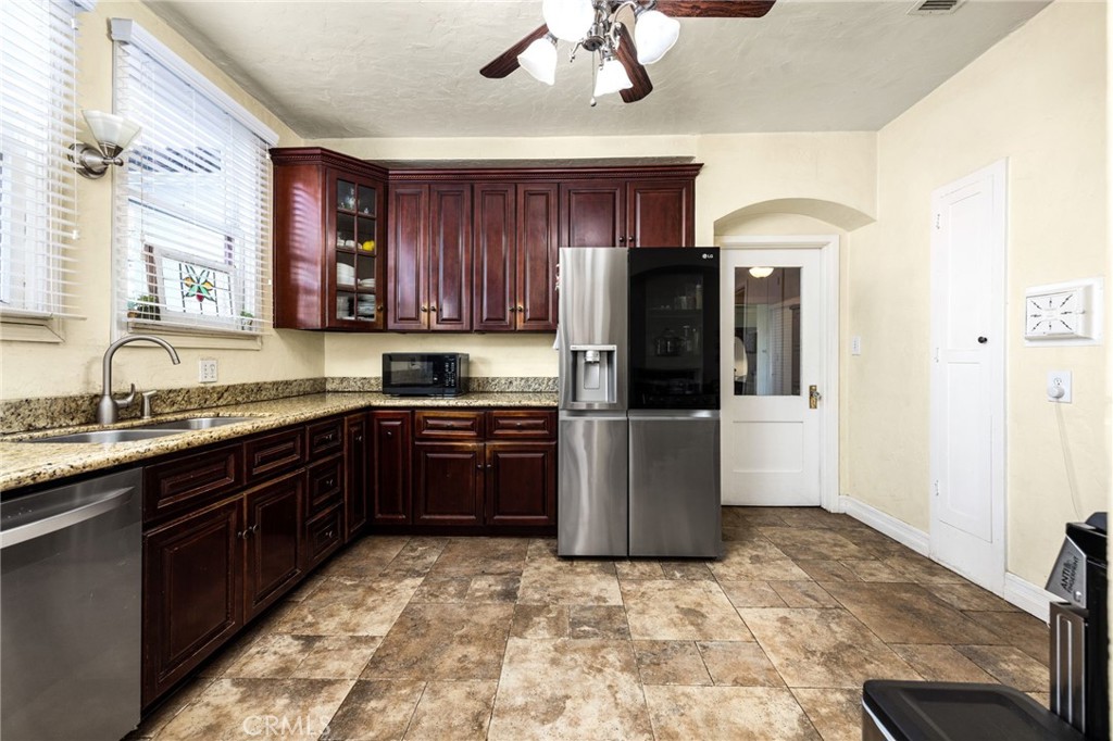4202 University Riverside, CA 92501 - Photo 30 of 53 a kitchen with stainless steel appliances granite countertop a refrigerator and a sink