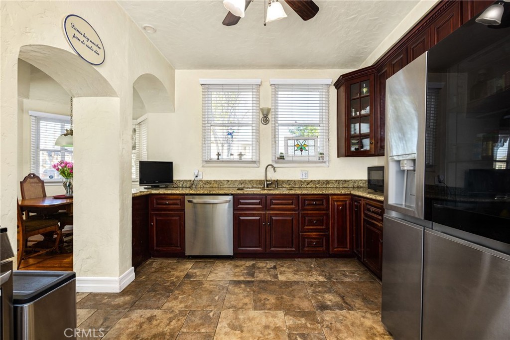 4202 University Riverside, CA 92501 - Photo 31 of 53 a large kitchen with stainless steel appliances granite countertop a refrigerator and a stove top oven