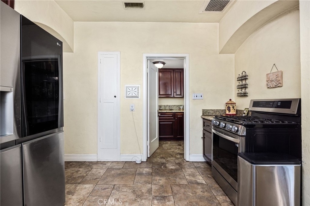 4202 University Riverside, CA 92501 - Photo 33 of 53 a kitchen with a stove and a refrigerator