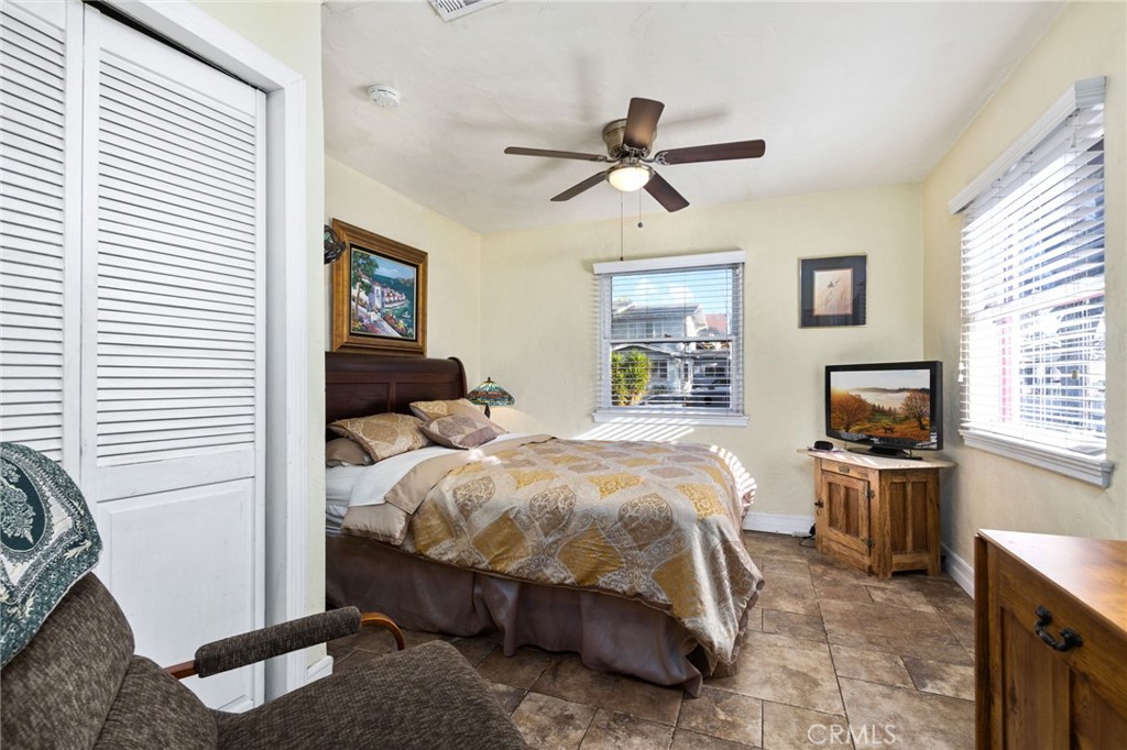 4202 University Riverside, CA 92501 - Photo 34 of 53 a bedroom with a bed and wooden floor